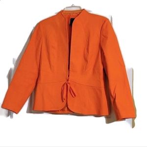 Focus 2000 orange quilt like Jacket with string closure and clasp.